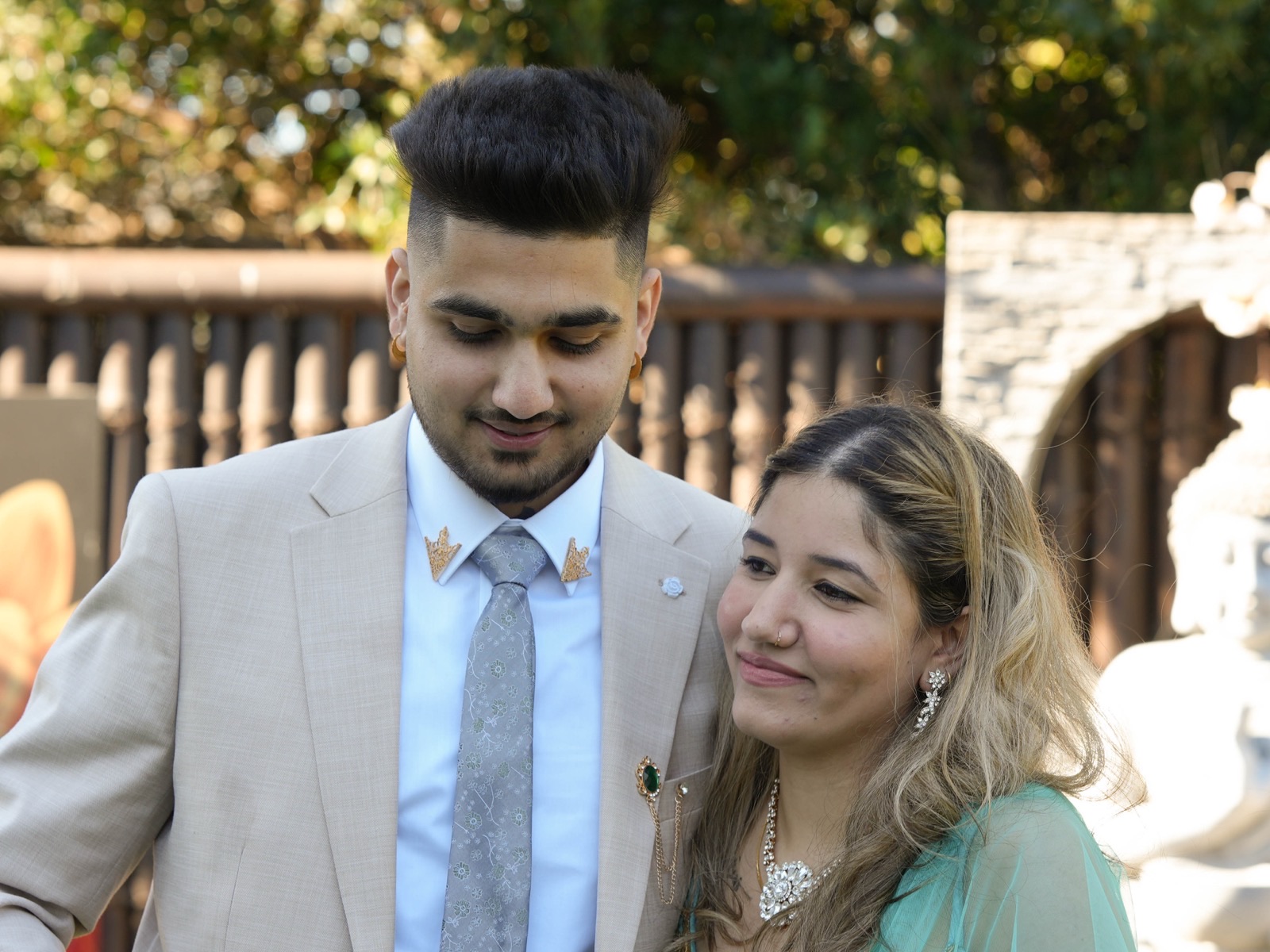 Bhavdeep with his arm around Nancy at their backyard wedding in Sydney