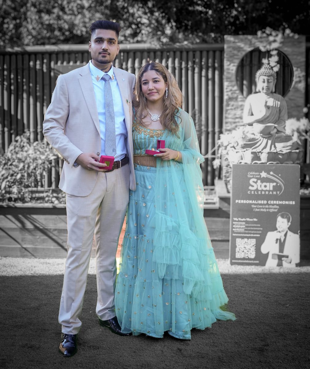 Couple holding ring boxes at their Sydney wedding ceremony