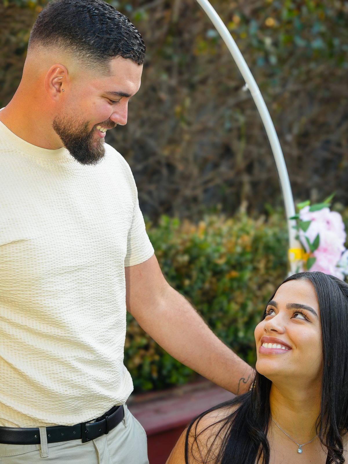 A tender moment between Pericles and Estafani at their Brazilian wedding in a Sydney garden