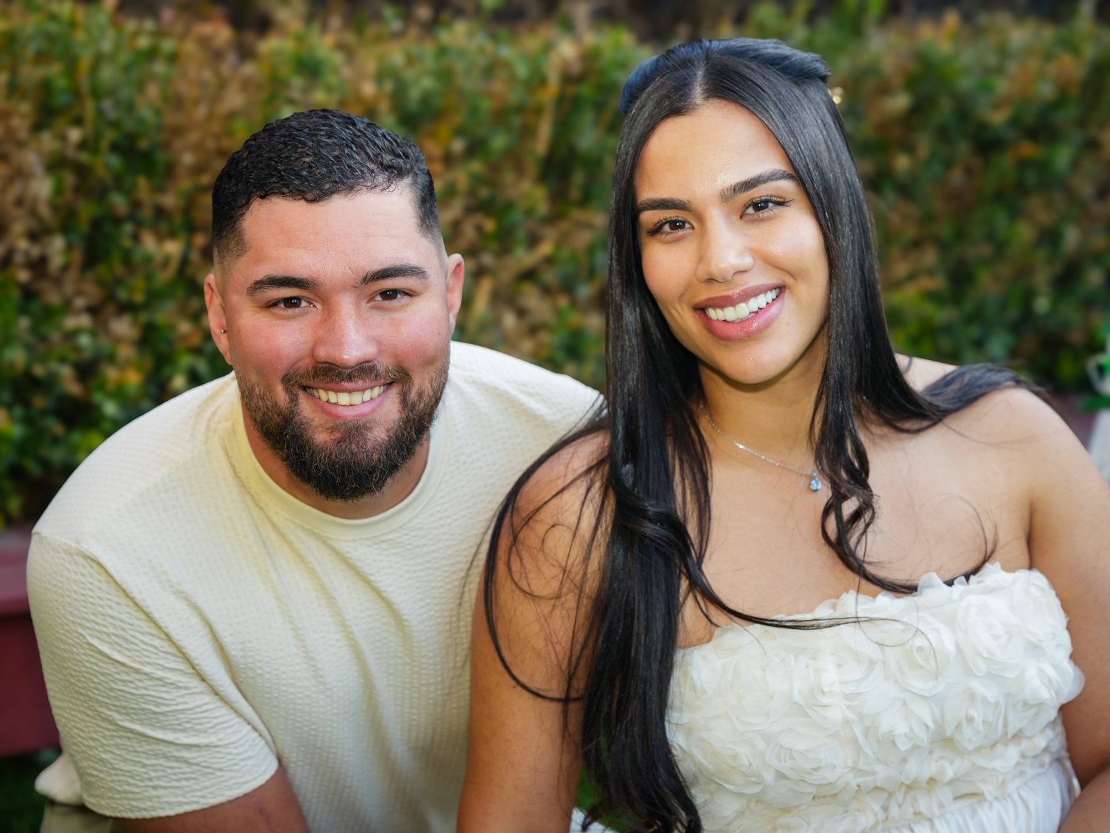 Pericles and Estafani smiling together at their intimate garden wedding in Sydney