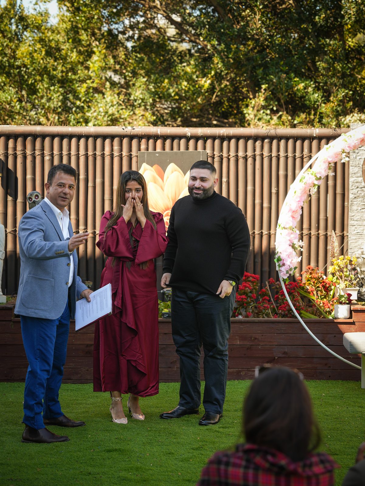 An emotional moment for the bride during an intimate Punjabi and Lebanese garden wedding ceremony in the Hills District, Sydney