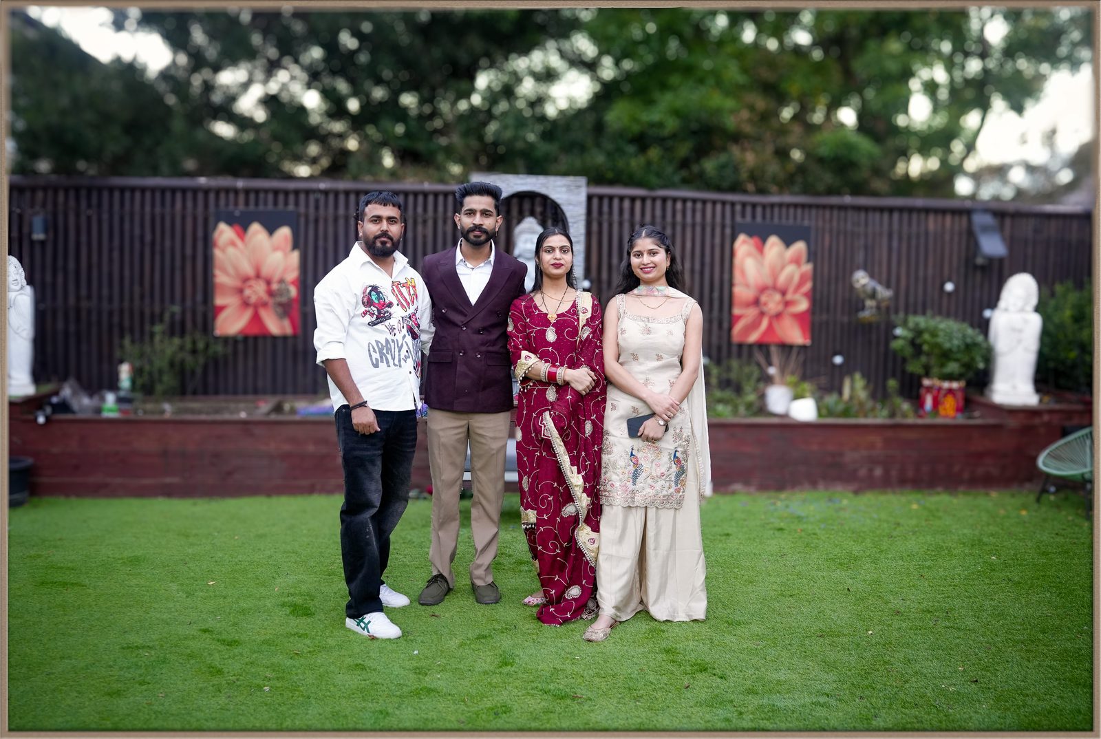 The Bella Vista garden set up for a wedding ceremony, with Buddha statues, lotus artwork and lawn