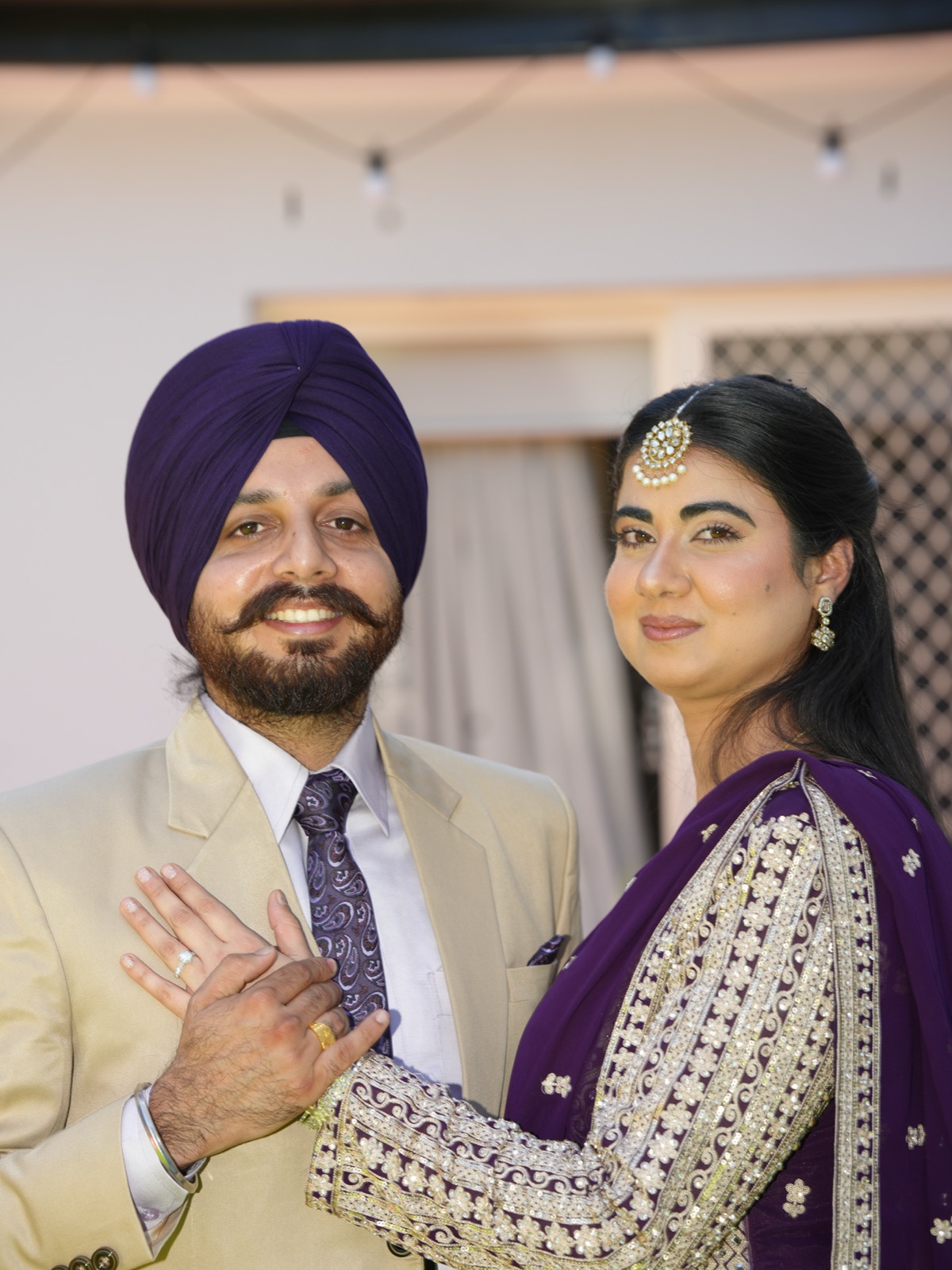 Kanwarpal and Jashandeep showing their rings with hands together at their Sikh wedding and engagement in Sydney
