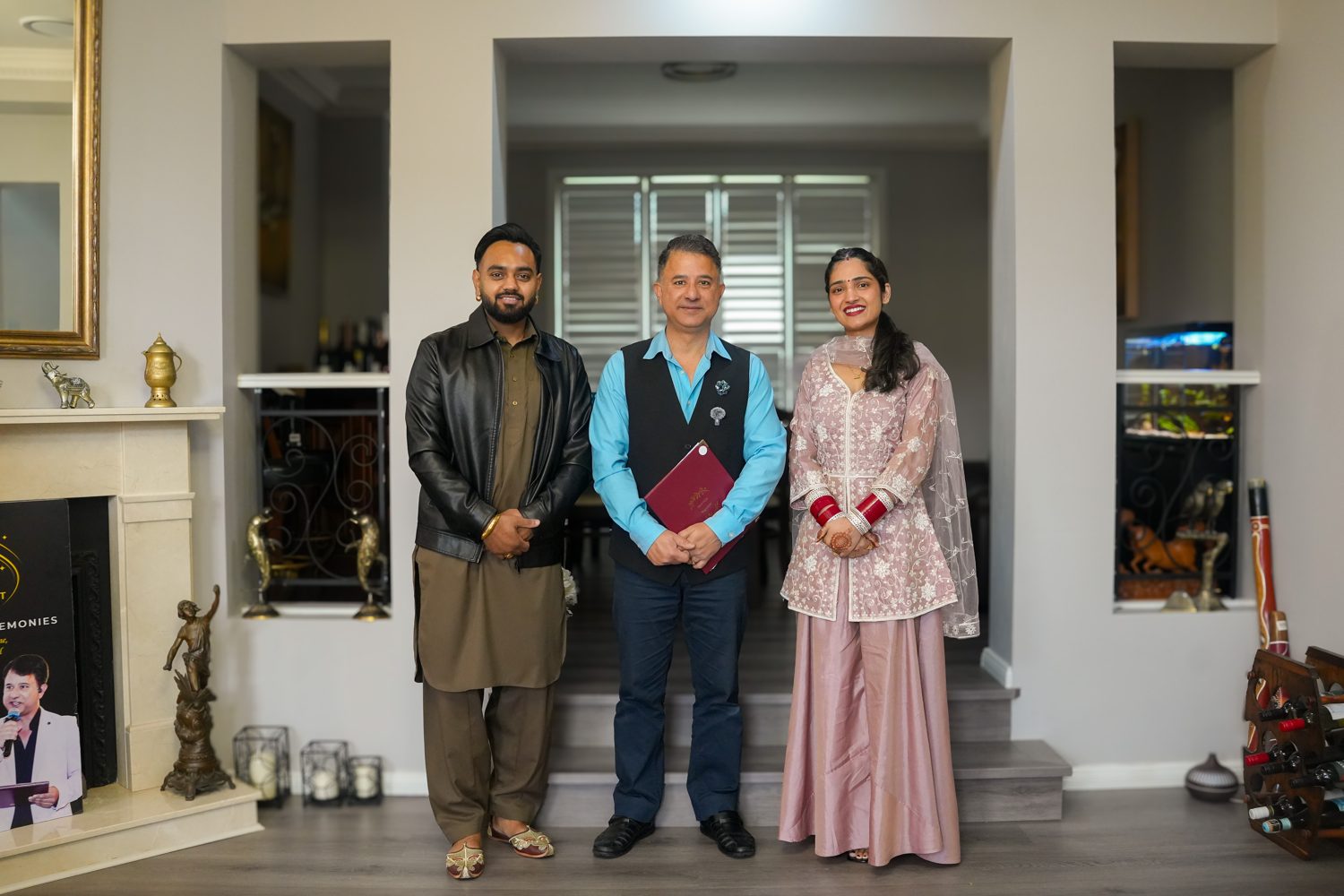 Sydney celebrant Rohit Revo with Lakhwinder and Harpreet and their marriage certificate after their civil ceremony in Bella Vista