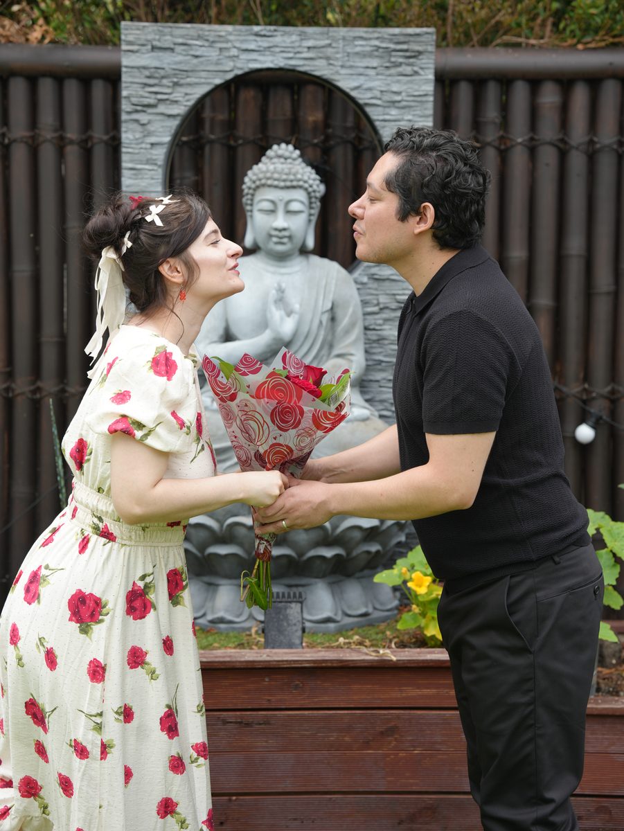 Couple sharing a moment with roses at a Sydney wedding ceremony