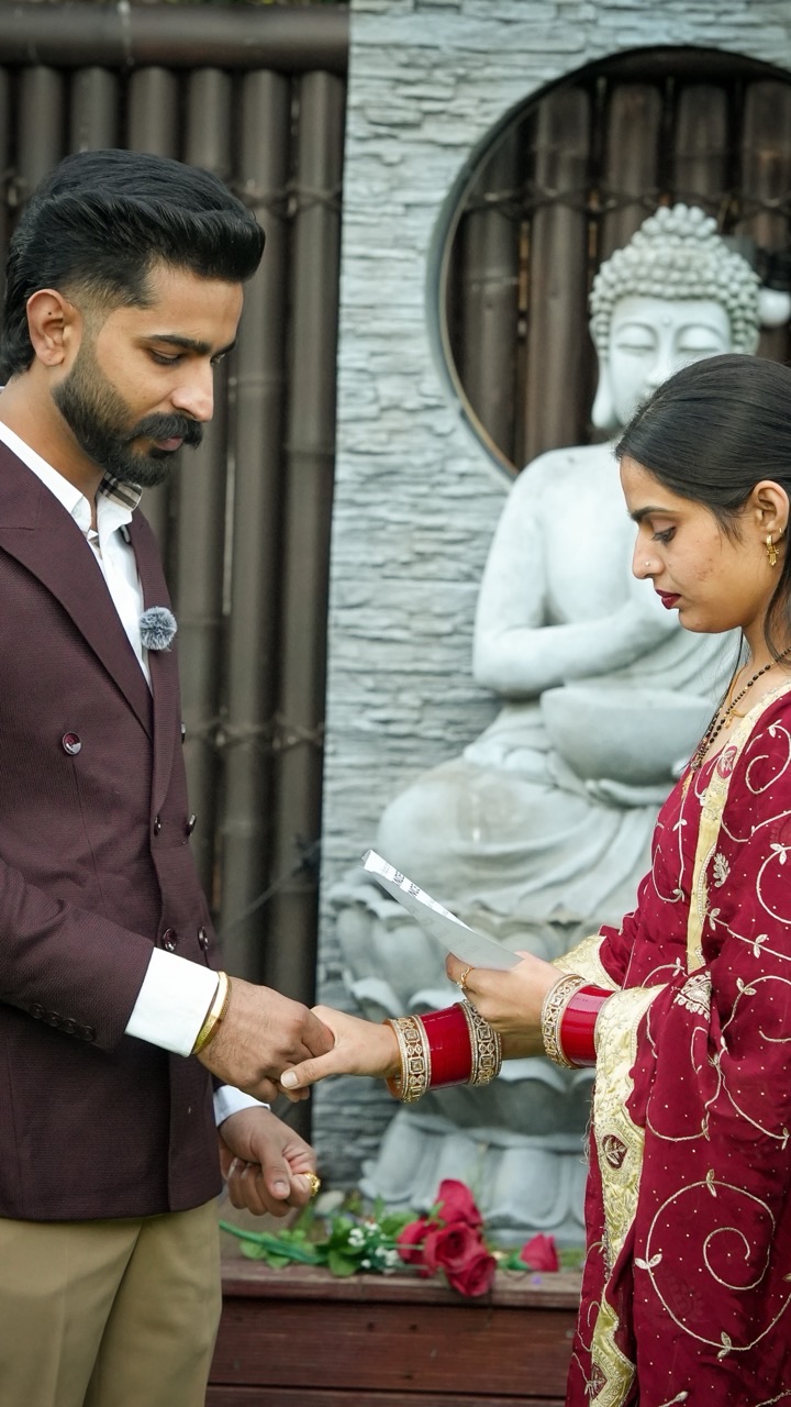 Prince placing a ring on Sagandeep's hand at their Sydney elopement — video