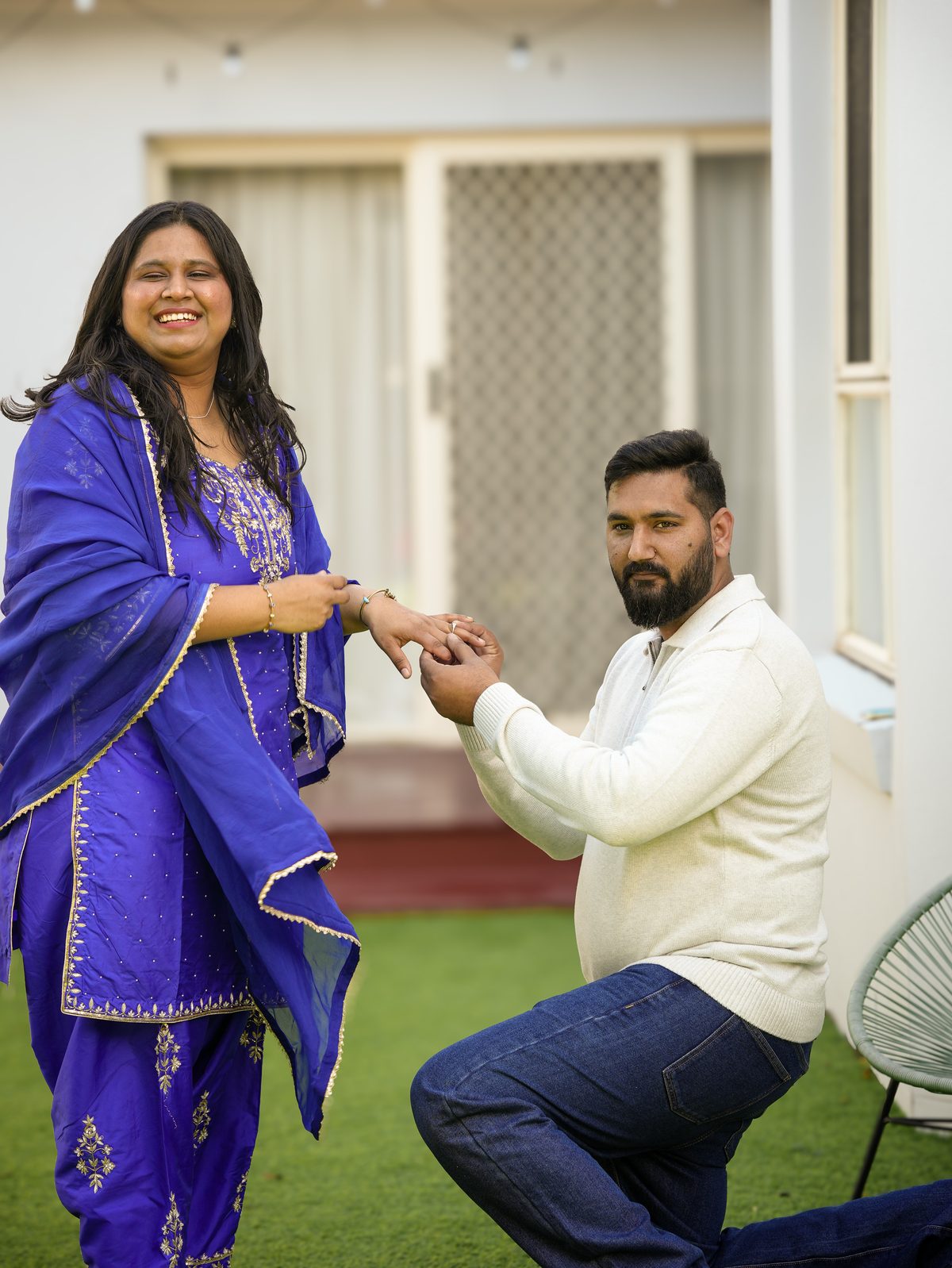 The ring exchange at Amandeep and Sonia's intimate Punjabi wedding in a Sydney garden