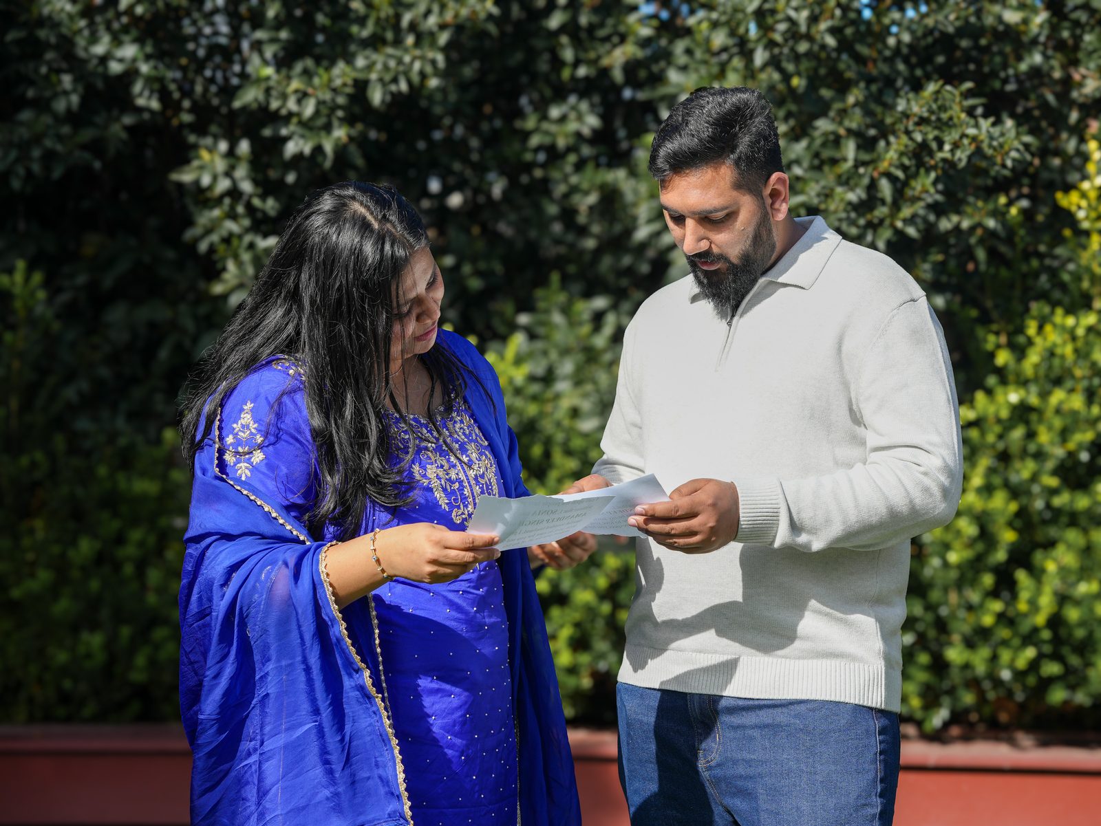 Amandeep and Sonia reading their vows together at their Sydney garden wedding