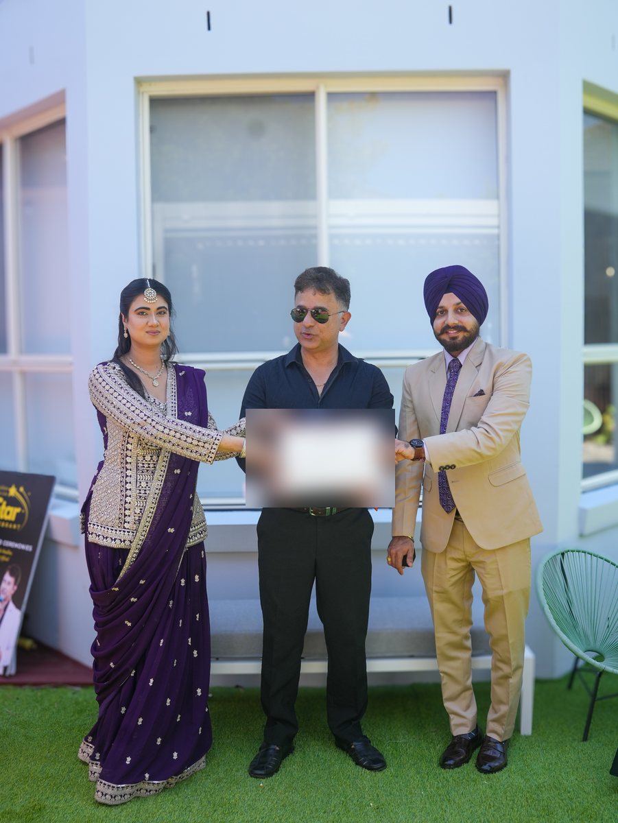 Star Celebrant with a Sikh couple holding their marriage certificate after a legally recognised ceremony in Sydney