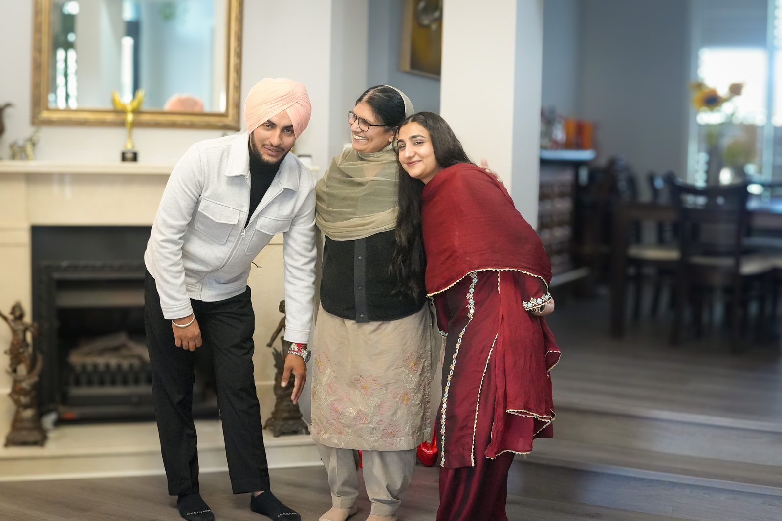 Anchaldeep embracing her mother while Inder stands close at their intimate court marriage in Sydney